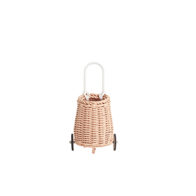 Olli Ella rose rattan doll luggy with woven basket body white loop handle and small wheels for imaginative play