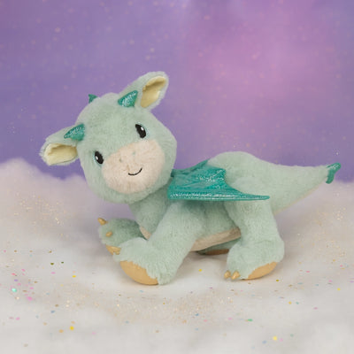 Mint green dragon plush toy with glittering teal wings embroidered eyes and soft tactile features from Dinkum Pets for imaginative play and cuddles