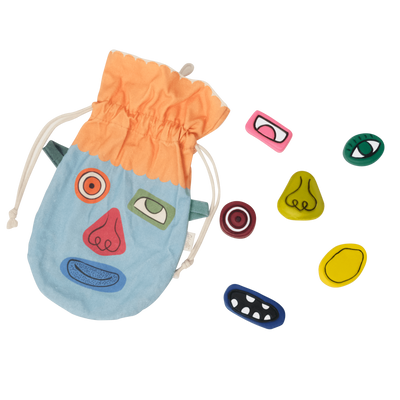 Olli Ella Kids Silly Sam sensory stones in a blue drawstring pouch with colorful interchangeable eyes noses mouths and glasses for imaginative play