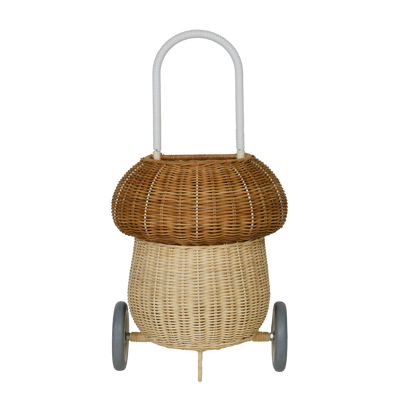 Olli Ella natural two tone rattan mushroom luggy basket with a rounded cap white pull handle and two wheels for imaginative play