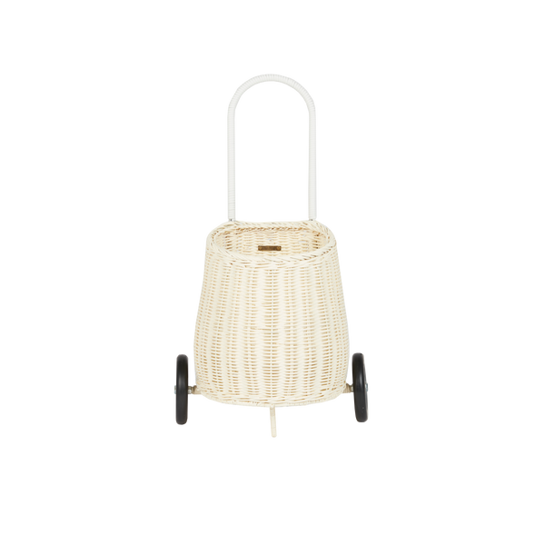 Chalk rattan toddler luggy basket with tall loop handle and two wheels by Olli Ella for imaginative play and carrying toys or treasures