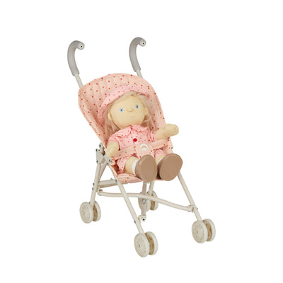 Dinkum Dolls doll seated in a pink quilted strawberry print stroller seat with a canopy and cream frame for imaginative play