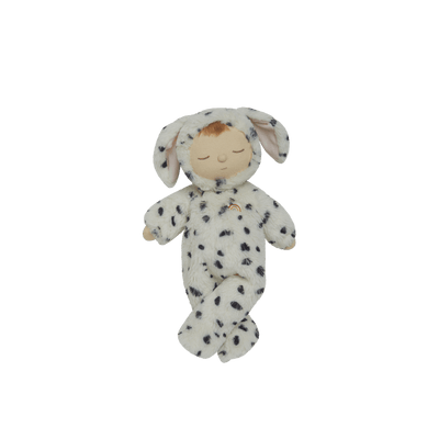 Cozy Dinkums spotted dog plush doll with floppy ears and an embroidered sleeping face wearing a soft white onesie with black spots