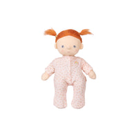 Plush doll with red hair in pigtails wearing a pink outfit on a white background