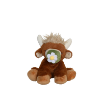 Plush toy bull with a flower on a white background