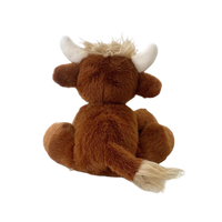 Plush toy of a brown yak with white horns on a white background