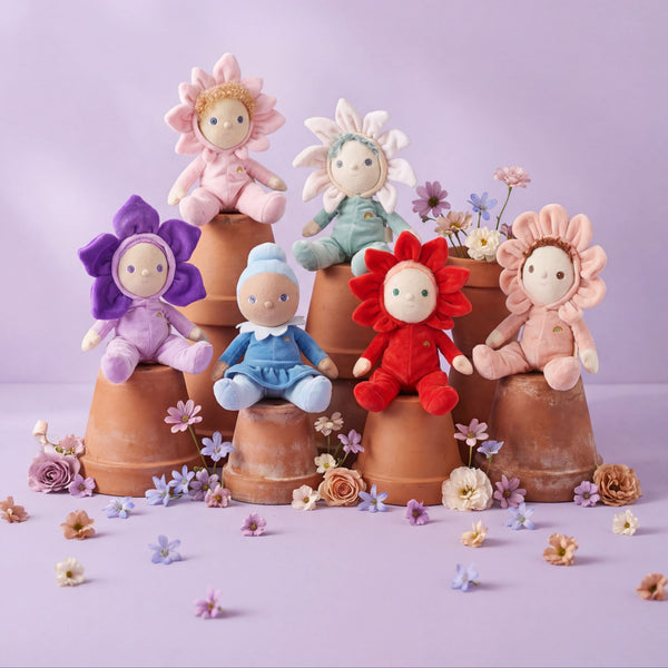 Colorful flower-shaped dolls on terracotta pots with a light purple background