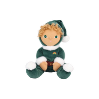 Plush doll with curly golden hair and embroidered green eyes, dressed as a Christmas elf in a dark green velvet suit and pointed hat with white fluffy trim, a brown belt, and a small rainbow patch on the chest.