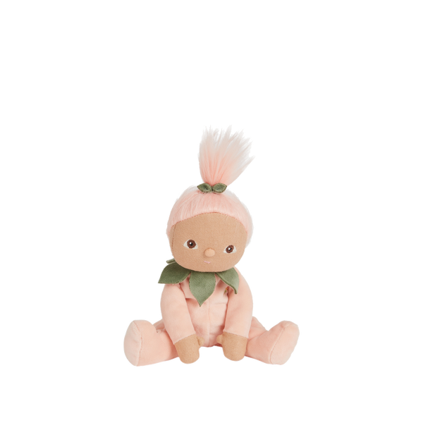 Dinky Dinkums Peggy Peach doll in a soft peach outfit with a leafy collar and pink yarn hair styled in a topknot seated against a plain background.