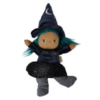 A plush witch doll with brown skin, green eyes, and bright teal hair, wearing a dark navy pointed hat with a white crescent moon, a dark navy dress, a black starry skirt, and black-and-white striped socks, isolated on a white background.