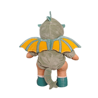 Baby dinosaur costume with yellow wings on a white background
