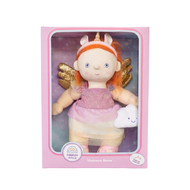 Dinkum Dolls Unicorn Nova doll in pink packaging with bright ginger hair a unicorn headband golden wings and a small white unicorn companion toy