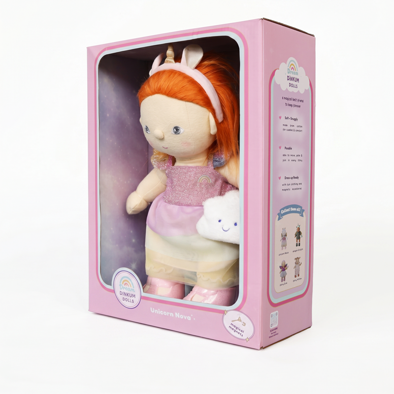 Unicorn Nova Dinkum Dolls doll with bright ginger hair and unicorn headband wearing a pink outfit and holding a cloud plush in a pink display box