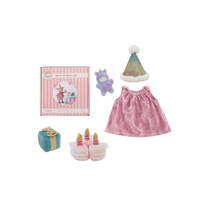 Collection of children's items including a pink dress, hat, toy, and cake set on a white background.