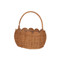 Natural rattan Petal Basket with a scalloped edge and sturdy arched handle by Olli Ella Kids Rattan for carrying toys treasures or Easter eggs