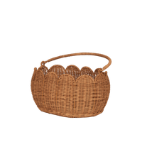 Natural rattan Petal Basket with a sturdy carry handle and scalloped petal inspired edge for storing toys treasures and Easter finds by Olli Ella Kids Rattan