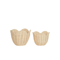 Two buttercream rattan lily baskets with scalloped flower inspired edges for nursery storage and imaginative play from Olli Ella Nursery