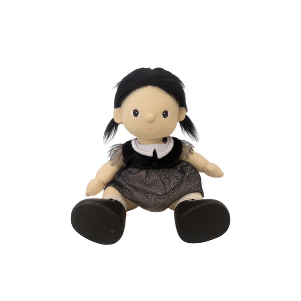 Toy doll with black hair, wearing a black top and brown skirt on a white background