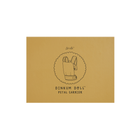 Dinkum Dolls Petal Carrier packaging in buttercup yellow with a simple line illustration of the doll carrier and printed product branding