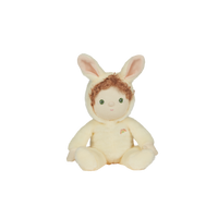 Dinky Dinkums Fluffle Family bunny doll with soft cream fur curly brown hair long ears and a tiny rainbow detail sitting against a plain background