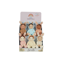 Dinky Dinkums Fluffle Family six soft dolls in bunny outfits displayed in pastel packaging with varied skin tones and colours for imaginative play and gifting