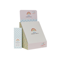 Dinky Dinkums Fluffle Family packaging with pastel rainbow branding and a matching blue checked box displayed against a white background