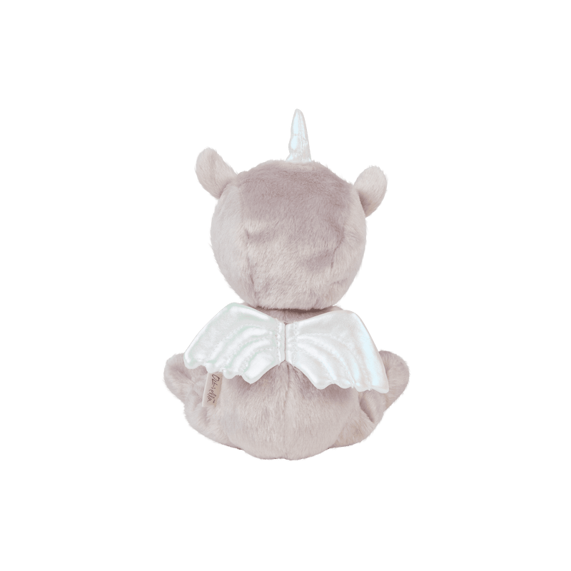 Back view of Dinky Dinkums Uma Unicorn doll with soft lilac fur a silver horn rounded ears and shimmering white wings