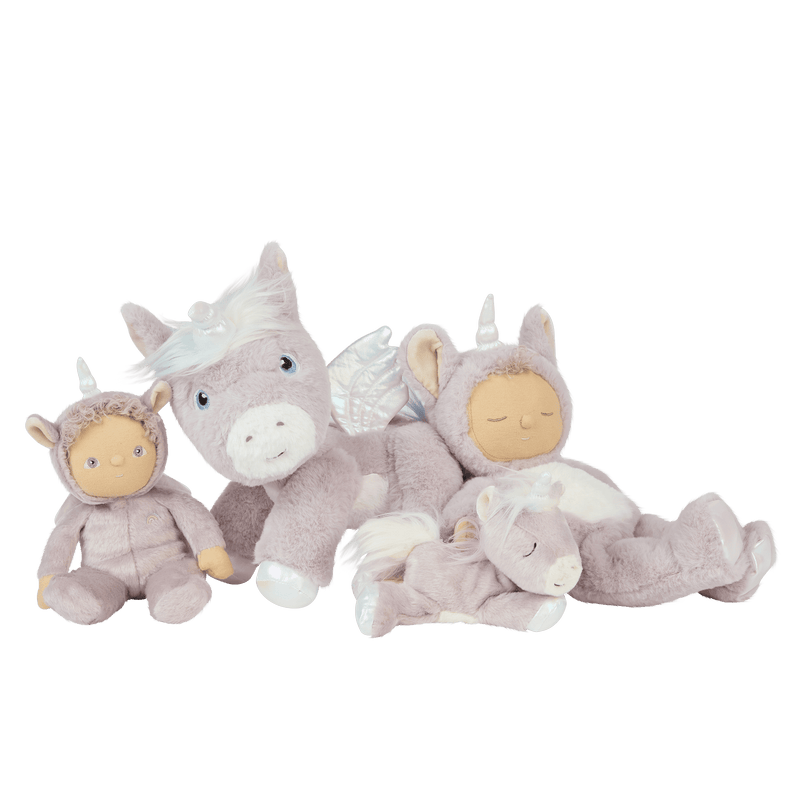 Dinky Dinkums unicorn dolls and plush toys in soft lilac and cream tones including a winged unicorn and two hooded dolls arranged together for imaginative play