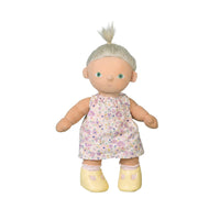 Plush doll with a floral dress on a white background