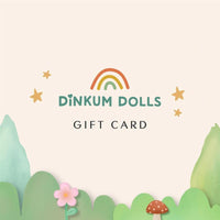 Dinkum Dolls gift card featuring a rainbow logo stars pastel flowers and playful illustrated greenery