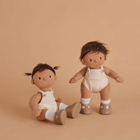 2 plush baby dolls with brown hair, beige romper, and brown shoes