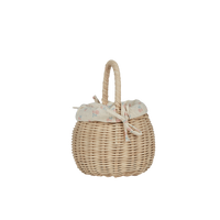 Handwoven rattan berry basket with cream floral cotton liner and tied handles from Olli Ella Kids Rattan for imaginative play