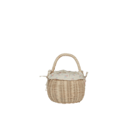Small handwoven rattan berry basket with a removable cream floral cotton lining and rounded handle for imaginative play with dolls and toys