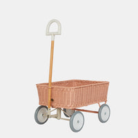 Rose rattan toy wagon with four wheels and a tall wooden pull handle by Olli Ella Kids Rattan for imaginative play and collecting treasures