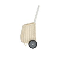 Chalk rattan toddler luggy basket with a long pull handle and two wheels for carrying toys and treasures from Olli Ella
